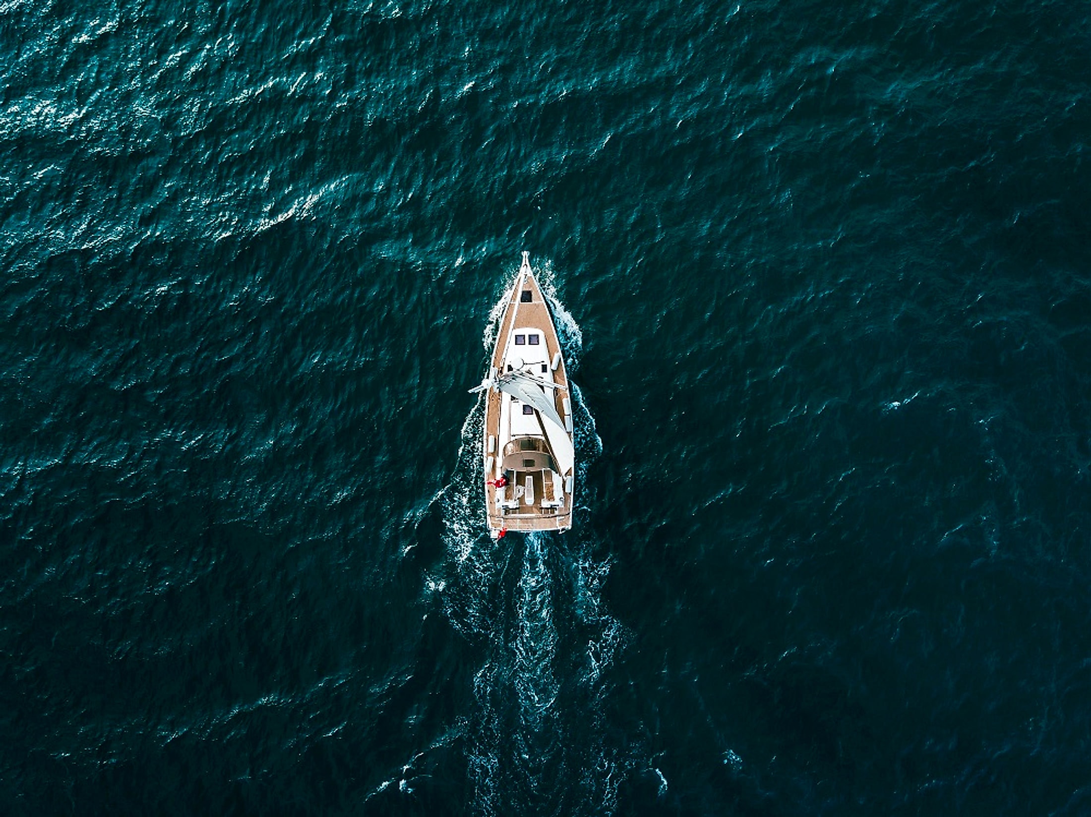 A yacht charting a steady course across open water