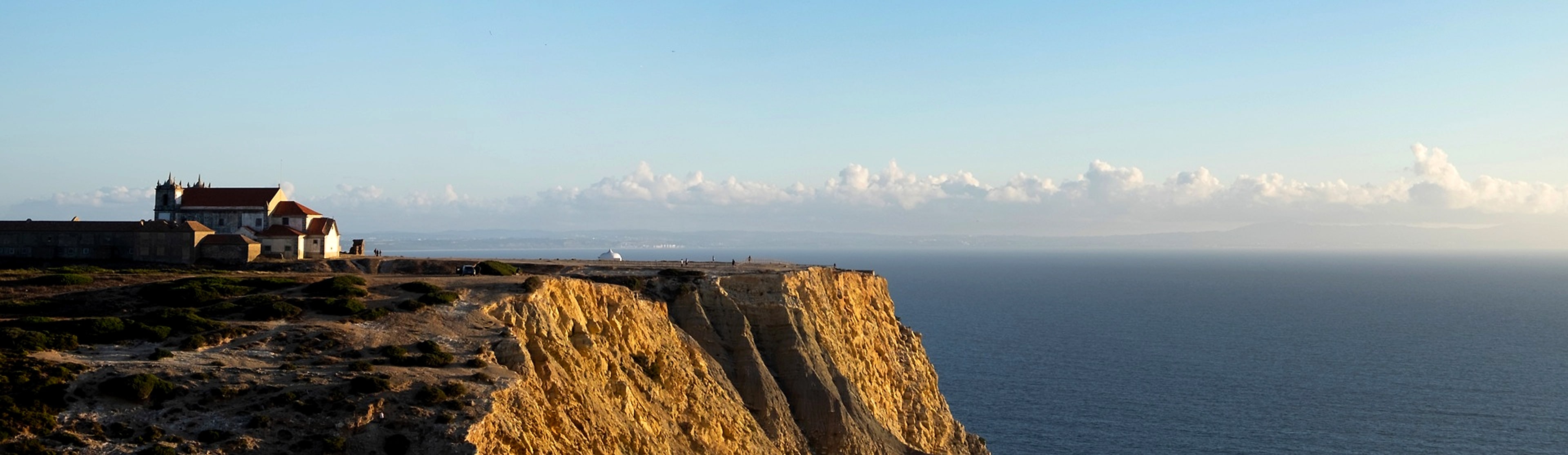 A small chapel standing firm on the sea cliffs of Cabo Espichel, Portugal